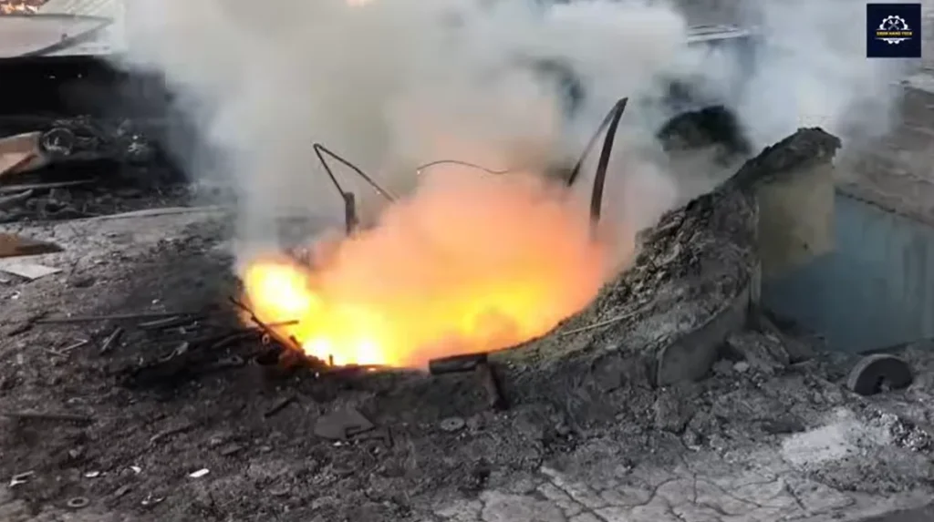 Molten metal glowing in a furnace during stainless steel scrap melting